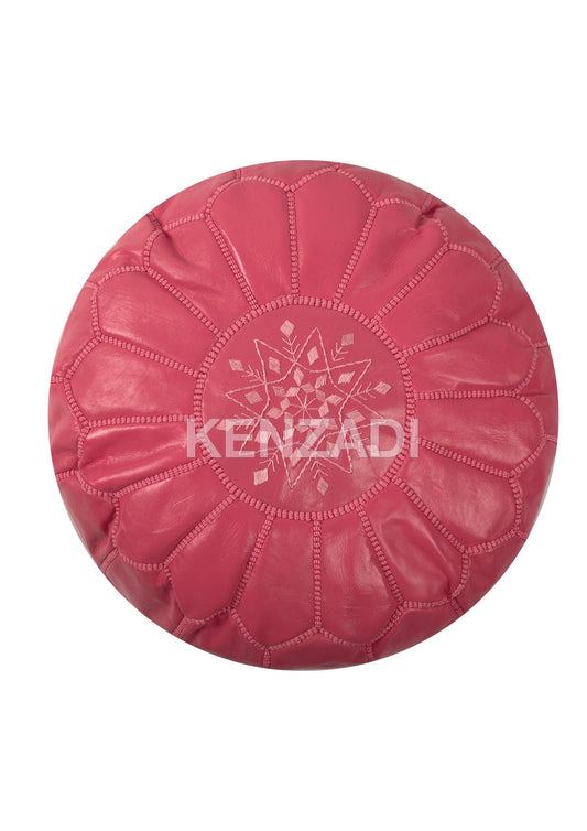Authentic Moroccan round leather pouf with pink embroidery. Handmade from premium Berber leather, perfect for adding a bohemian touch to your home décor.